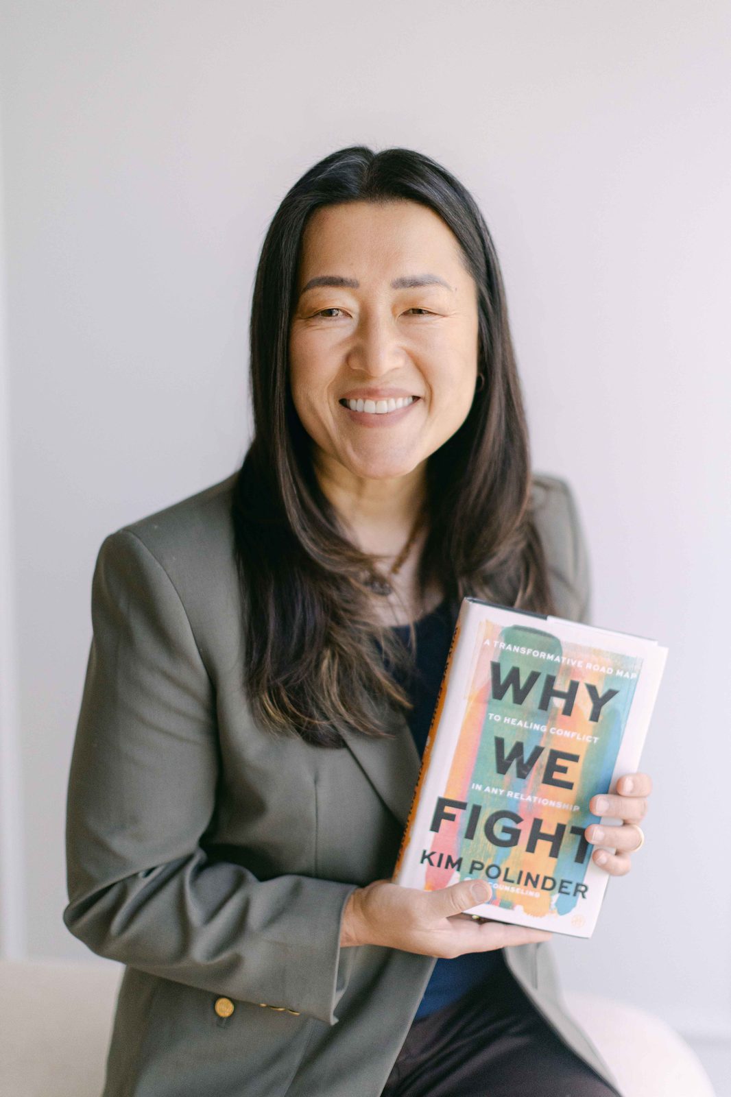 Kim Polinder holding Why We Fight